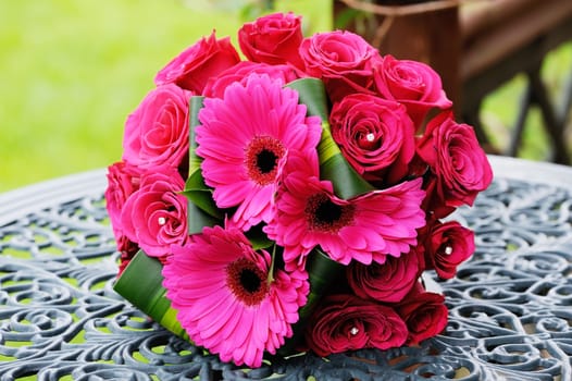 Closeup of brides flowers on wedding day are red roses