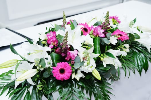 Closeup of flowers at wedding ceremony with pink and white