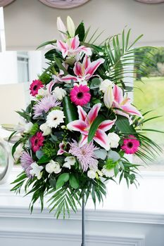 Wedding flower arrangement decorates ceremony interior closeup