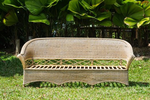 Wooden park bench in green the garden