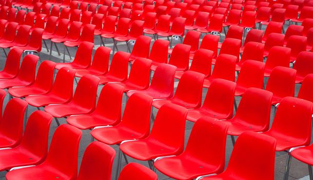 View of many red chairs ready for conference