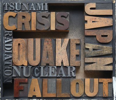 words related to Japan's earthquake, tsunami and nuclear disasters in old wood and metal type