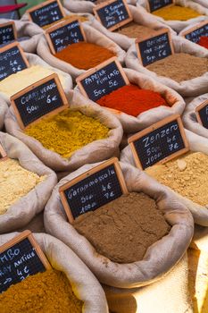 Differents oriental spices on canvas bags in the food street market