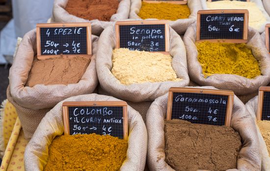 Differents oriental spices on canvas bags in the food street market