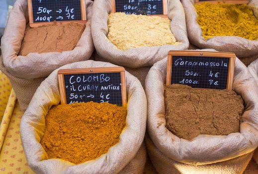 Differents oriental spices on canvas bags in the food street market