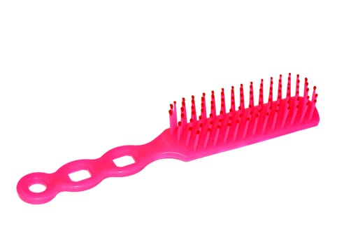 Bright pink plastic hair brush                               