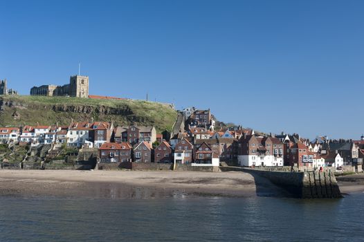 St Mary's Church, Tate Hill, Whitby overlooking the harbour and entrance to the river is a historical medieval landmark where Bram Stokers film on Dracula was filmed