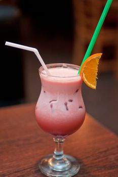 berry milkshake with orange fruit