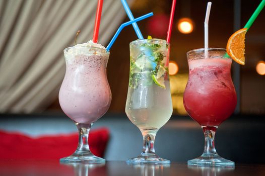 Set of three healthy nonalcoholic cocktails berries and classic mohito