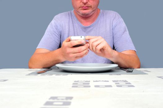 Gentleman waiting at a table waiting to eat alone