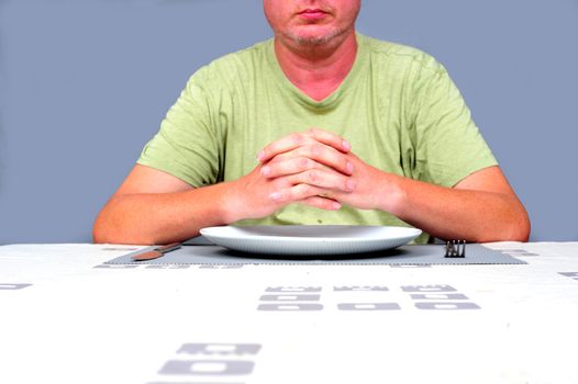 Gentleman waiting at a table waiting to eat alone