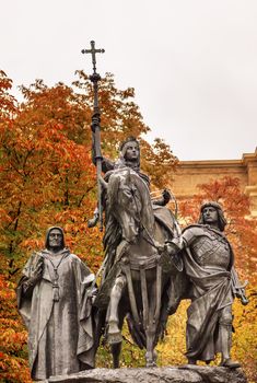Queen Isabella of Castile Statue Riding a Horse  Marching into Granada 1492 with Cardinal Mendoza and Gonzalo de Cordoba Paseo de la Castellena Madrid Spain.  Statue made of Bronze and Stone by Manuel Oms y Canet in 1883.
