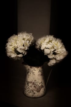 Vintage vase with flower still life in sepia style