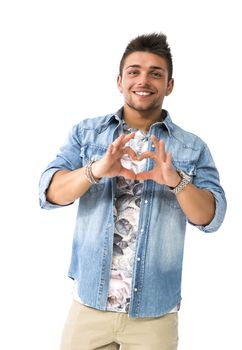 Handsome young man making heart sign with his hands and fingers. Studio shot isolated