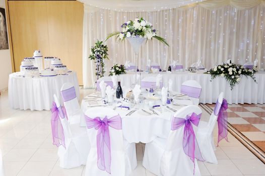 Wedding reception interior showing flowers and cake decoration