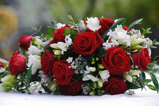 Brides red roses at wedding