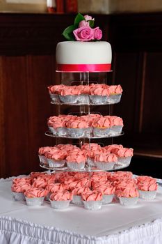 Wedding cup cakes on table at reception