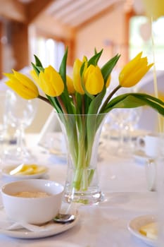 Yellow tulips table decoration at wedding