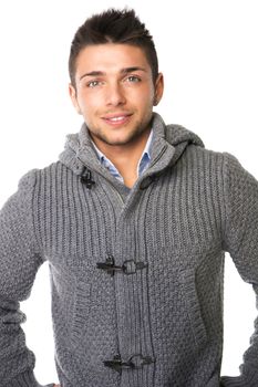 Good looking smiling young man wearing winter sweater, isolated on white