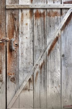old textured wooden door photographed in rural area