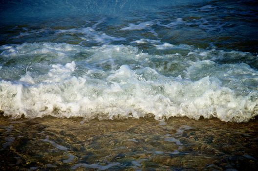 Splashing Waves in Transparent Sea Water on Coast Line Outdoors 