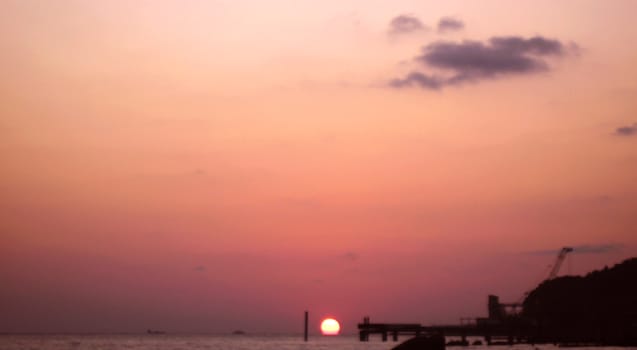 Sunset over summer sea with a small waves
