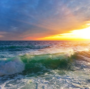 Sea wave at sunrise