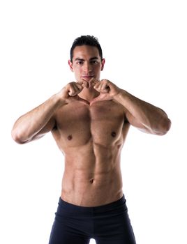 Shirtless muscular man making heart symbol with his hands on white background