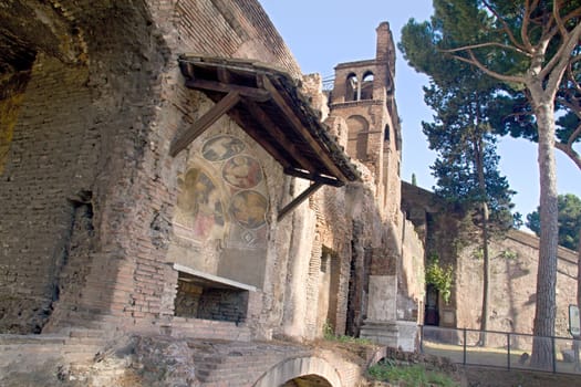 Photo shows Rome cityscape with houses and roofs.