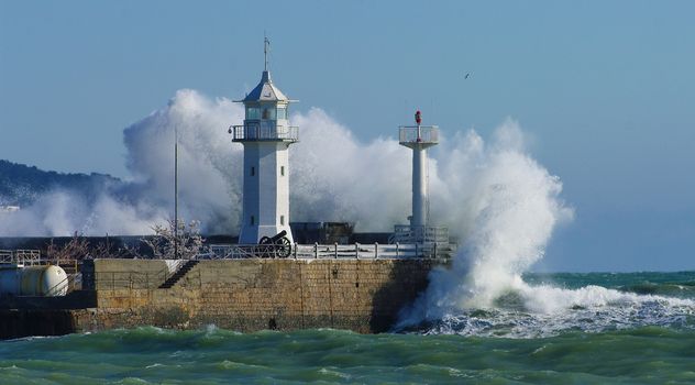 Lighthouse and big wave