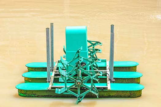 Green turbine water on pond