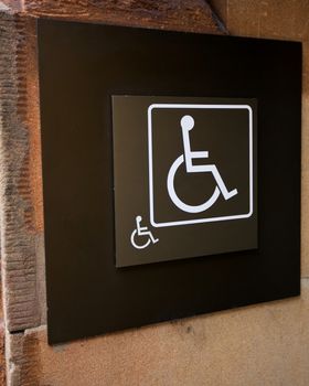 Wheelchair or Handicapped Sign on a Building