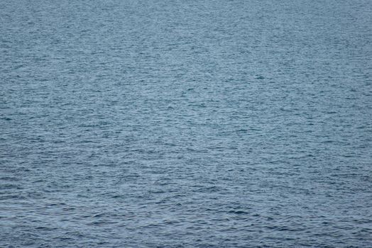 Background of ocean water around Greenland with water surface in light wind