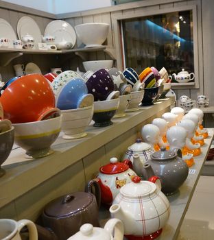 Ceramics shop, there are a variety to choose such as pot, crockery, bowl. They were arranged on shelves in an orderly.                               