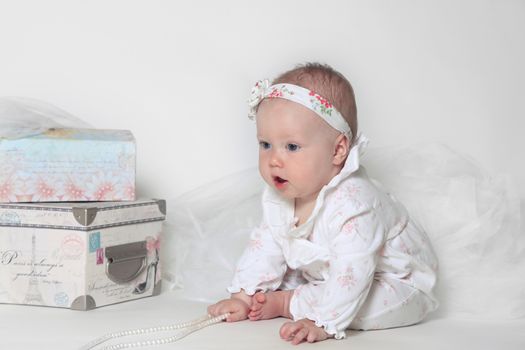 Beautiful small kid girl in studio