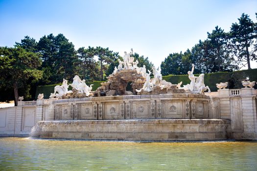 AUSTRIA, VIENNA - AUGUST 4,2013: View on Gloriette and Neptune fountain in Schonbrunn Palace, Vienna, Austria