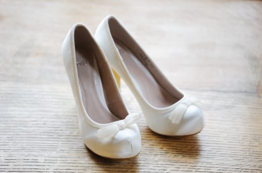 Brides white shoes with a on wood