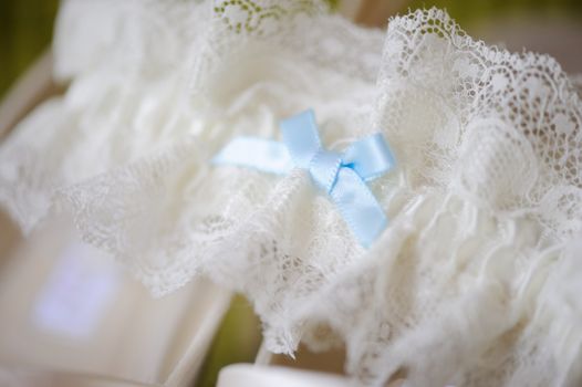 Brides garter closeup at wedding