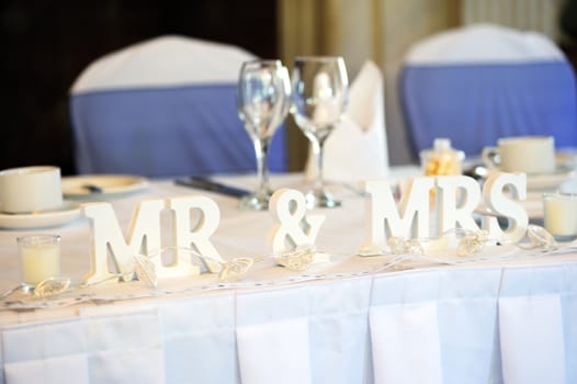 Mr & Mrs decoration on wedding reception table