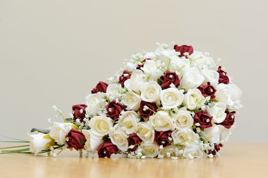 Bouquet of artificial red and white roses for bride
