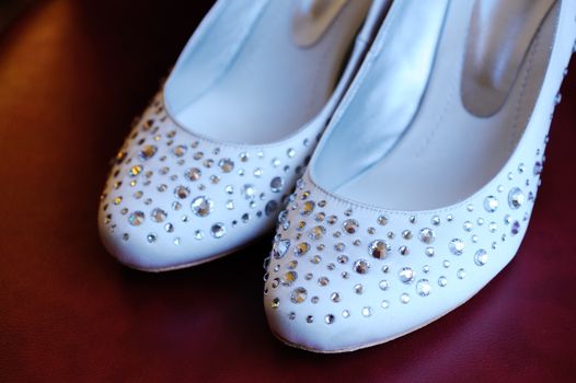 Brides shoes covered in shiny jewels