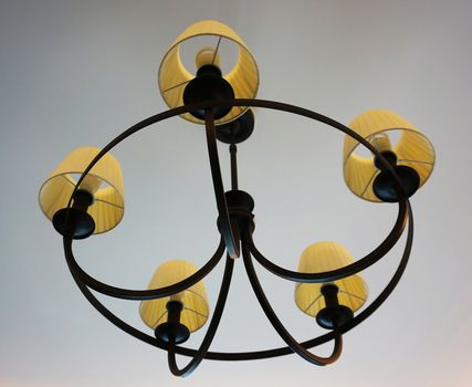 Decorative lamp on ceiling to illuminate the room and enhance the beauty of home.                               