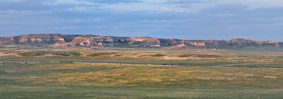 Pawnee National Grassland in northern Colorado  -  a panoramic view of short grass prairie and Chalk Bluff cliff in sunset light