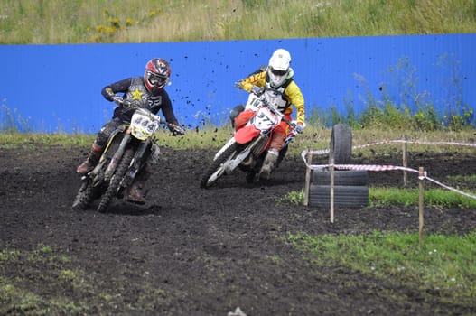 Racers on motorcycles participate in cross-country race competitions. 02.08.2014, Tyumen