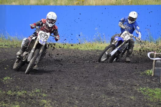 Racers on motorcycles participate in cross-country race competitions. 02.08.2014, Tyumen