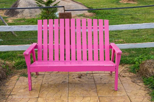 Pink bench in garden