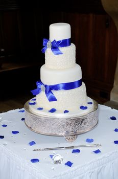 Blue and white wedding cake at reception