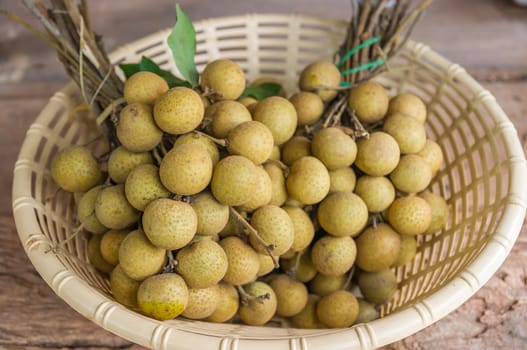 Fresh longan fruits in basket.