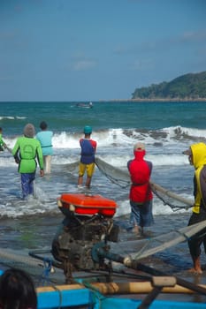 Pangandaran, Indonesia - July 16, 2011: Fisherman at Pangandaran beach, West Java-Indonesia.