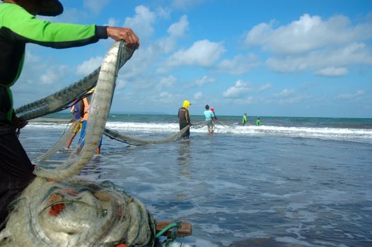 Pangandaran, Indonesia - July 16, 2011: Fisherman at Pangandaran beach, West Java-Indonesia.